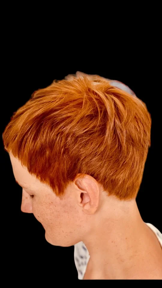 Short copper pixie cut on a real client at our Boca Raton salon