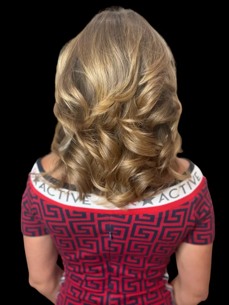 Glossy curls after a color and gloss at Hairmess Salon