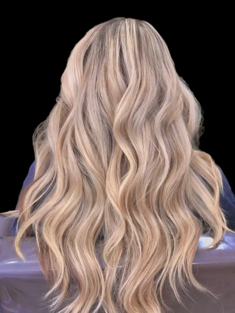 Blended blonde waves after an AirTouch color service at Hairmess Salon