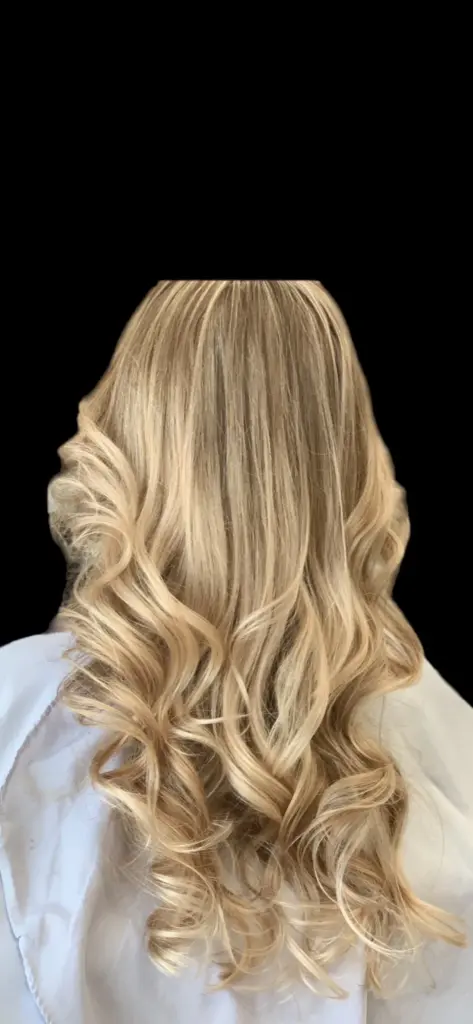 Long blonde hair after installing Golden Line extensions at Hairmess Salon in Boca Raton