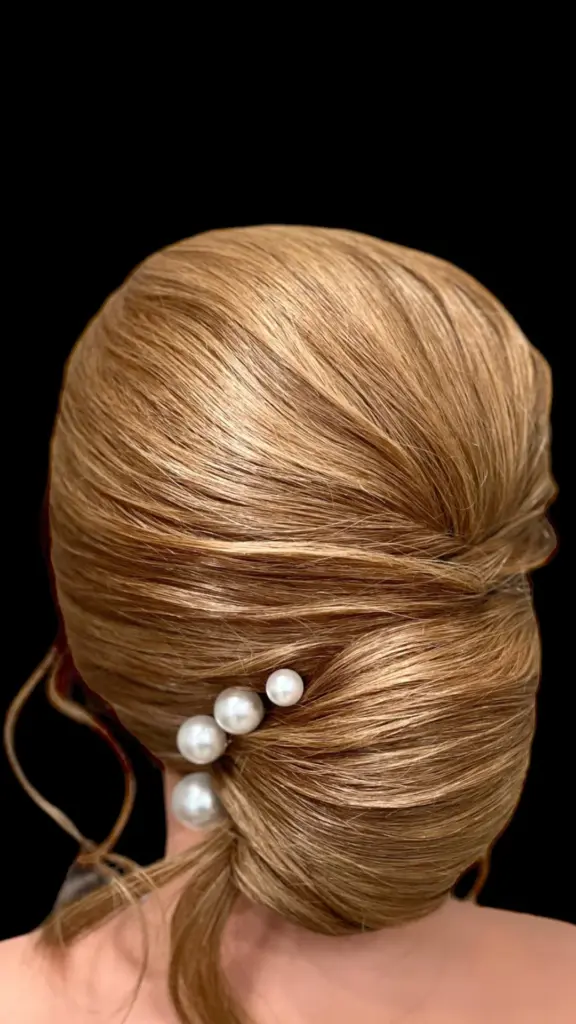 Bridesmaid updo with pearls styled at Hairmess Salon