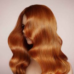 Woman with curly hair after a haircut and styling