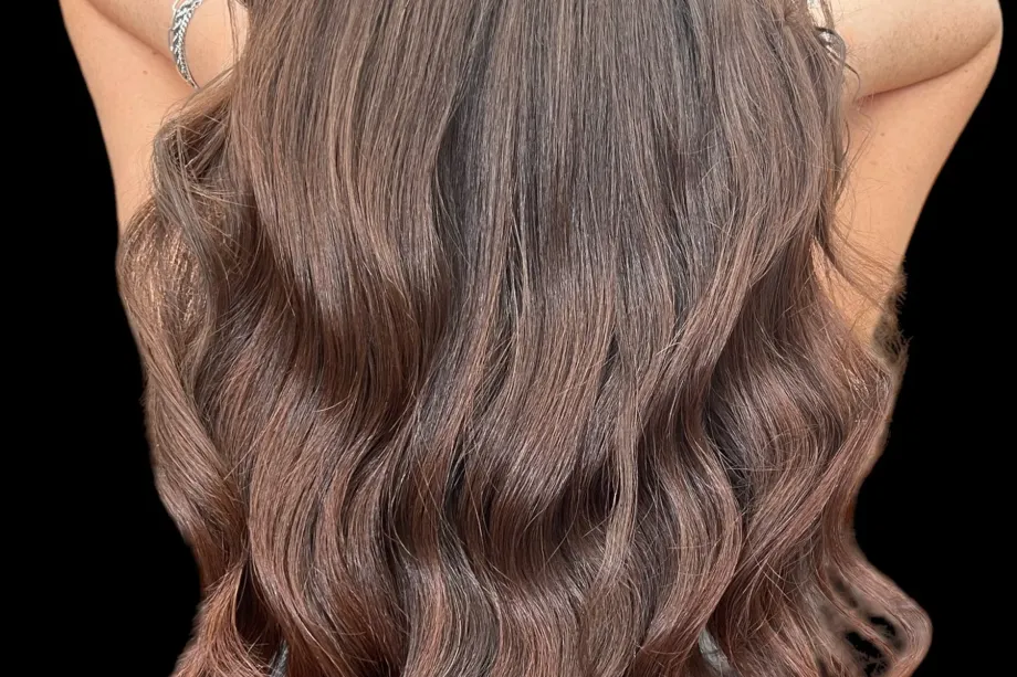 Long voluminous waves created with European human hair extensions in Boca Raton at Hairmess Salon