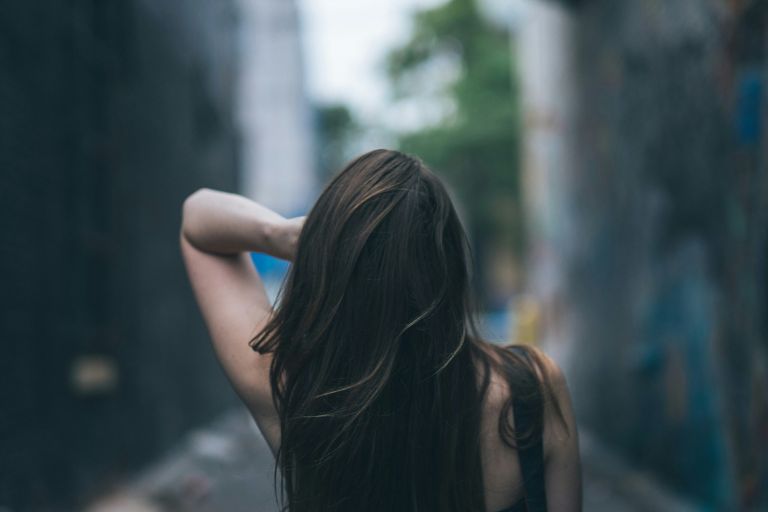 Long, full brunette hair with seamless hair extensions at Hairmess Salon