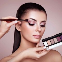 Makeup artist applying makeup at Hairmess Salon