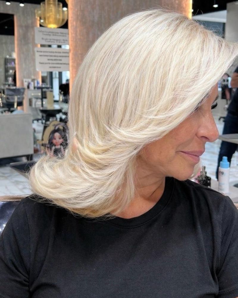Platinum blonde layered blowout at Hairmess Salon