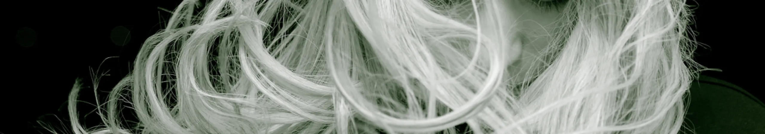 young woman with long hair posing Haircuts & Blowouts at Hairmess Salon: Style That Turns Heads